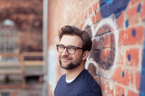 Portrait,Of,Smiling,Young,Man,With,Facial,Hair,Wearing,Eyeglasses