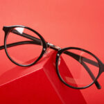 Eye,Glasses,On,Red,Gift,Box,Red,Background,Copy,Space