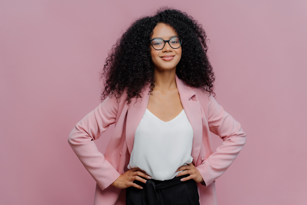 Waist,Up,Shot,Of,Satisfied,Dark,Skinned,Female,Office,Worker