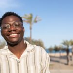 Portrait,Of,Young,Happy,And,Smiling,Black,Man,Wearing,Glasses