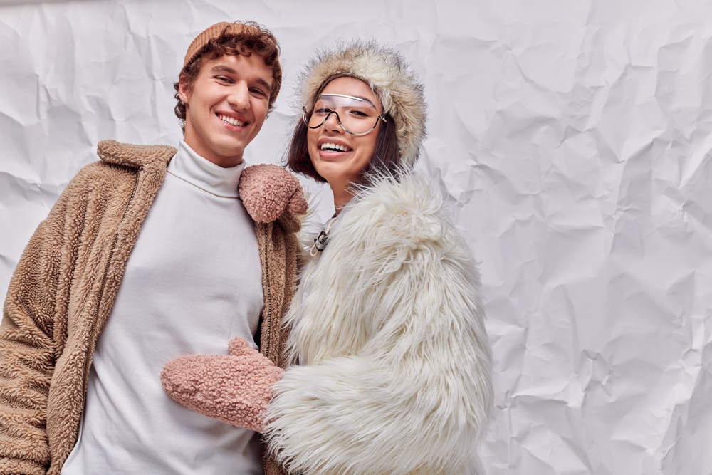 Joyful,Interracial,Couple,In,Fashionable,Warm,Outwear,On,White,Textured
